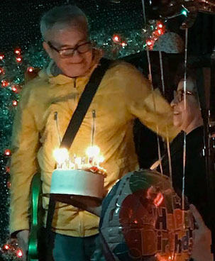 concepcion tadeo giving mike watt a cake on his 60th bday at 'bottom of the hill' in san francisco, ca on december 20, 2017