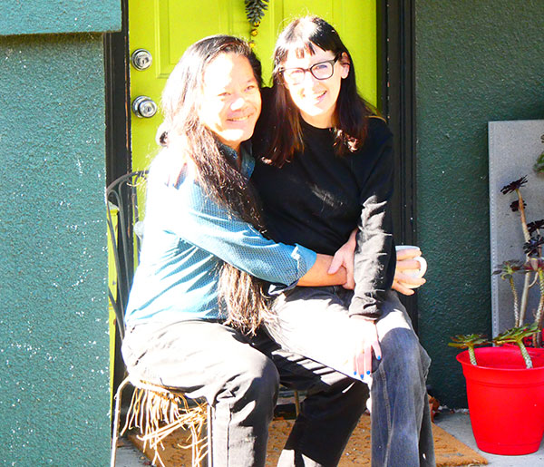 dr ray + dr robbin sitting in on the porch of their pad in oakland, ca on oct 31, 2024