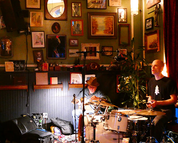 joe baiza + chris corsano (l to r) inside the 'the vault cafe' in nanaimo, bc, canada on oct 24, 2024