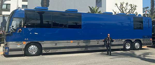 peter distefano in front of bus hired for the porno for pyros tour in santa ana, ca on february 13, 2024