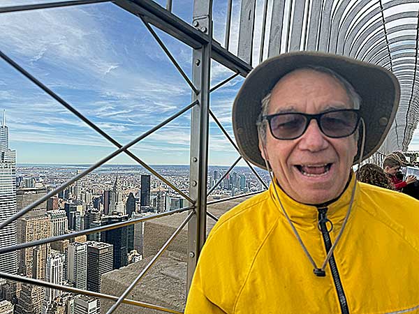 robin hatch's photo of mike watt spieling at the top of the empire state building in new york city, ny on march 8, 2024