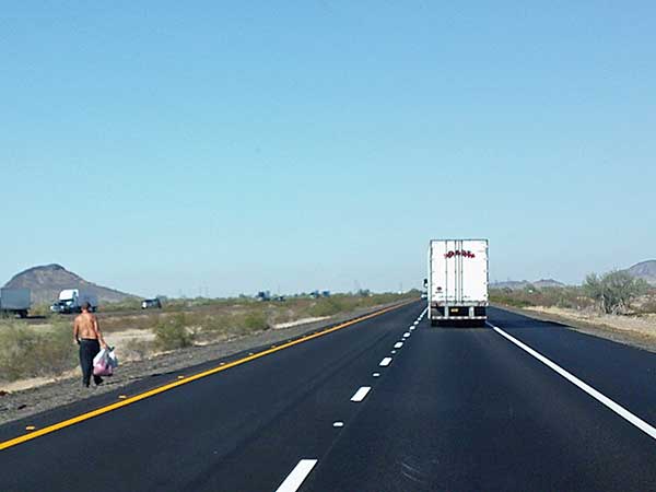 dude hoofing it on the I-10 in arizona west of tonopah on november 4, 2023