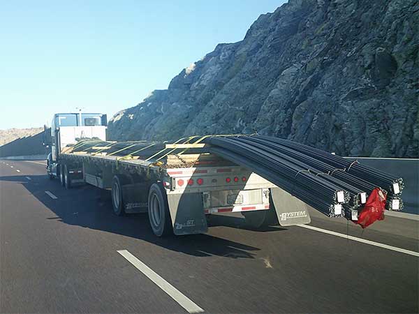 truck spotted on az-202 near phoenix w/rebarb hanging of off its culo on november 4, 2023