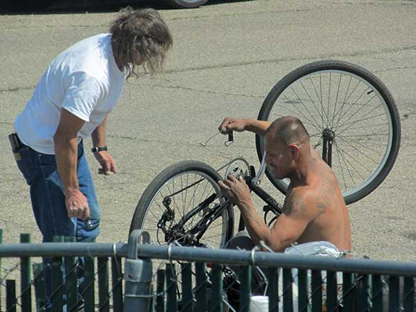 guys fixing bicycle in red bluff, ca