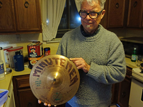 stephen hodges at bob teagan's w/hihat cymbal that belonged to george hurley and is signed by all three minutemen