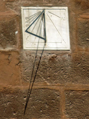 sundial on the side of saint mary's cathedral in seville, spain