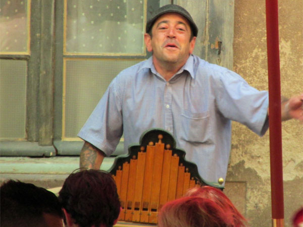 organ grinder man in albi, france - july 7, 2013