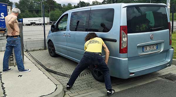 stefano pilila's photo of mike watt + paolo mongardi check/adjusting tire pressure on the way to hamburg, germany
