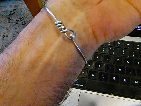 the bracelet from a bicyce spoke that pete barth made for mike watt